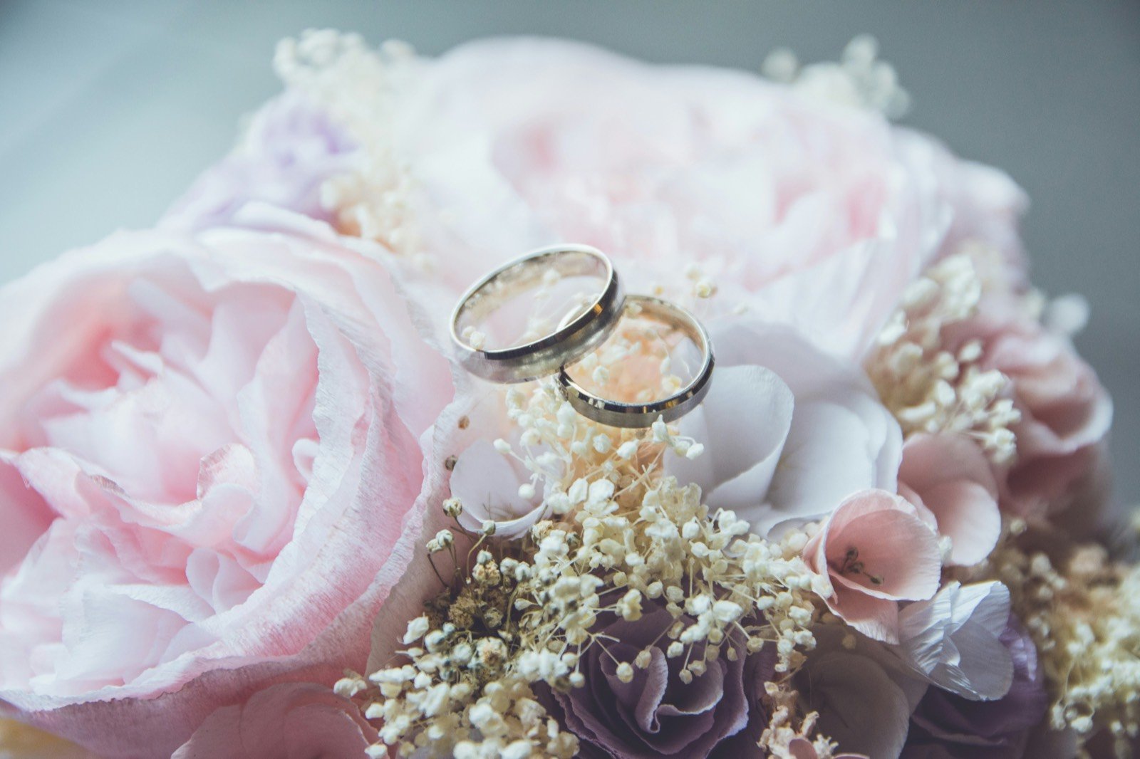 Wedding greeting card and elegant details on wooden table